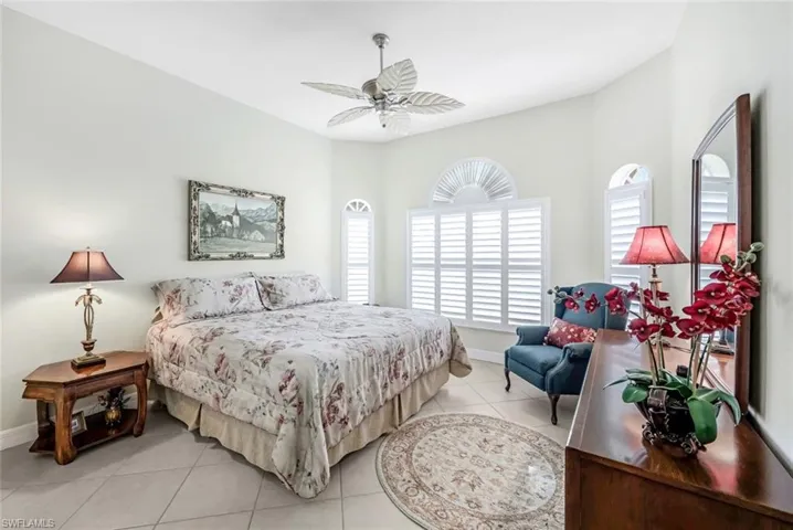 Tiled bedroom with ceiling fan