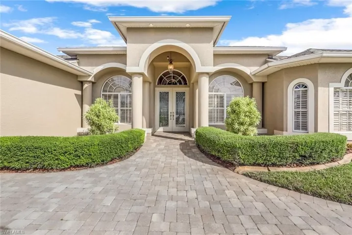 Property entrance featuring double french doors entry