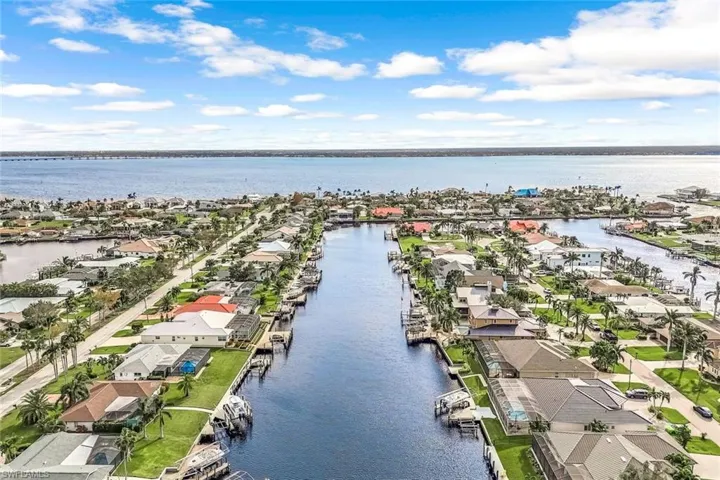 Drone / aerial view featuring almost 200' wide canal with 5 minute Direct Unrestricted Access to open waters and then Gulf of Mexico