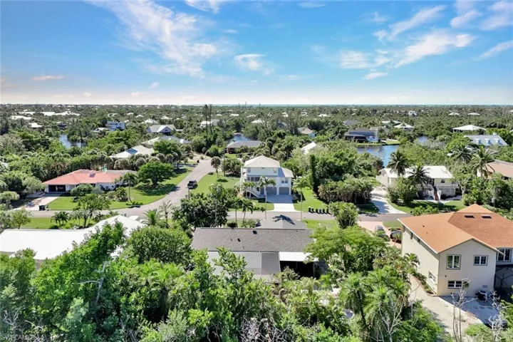 Aerial view of residential area with a tree filled landscape