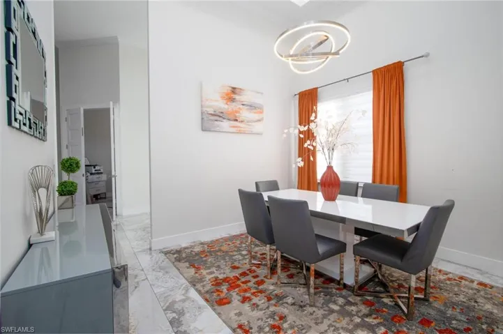 Dining area with crown molding