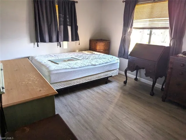 Bedroom featuring hardwood / wood-style flooring