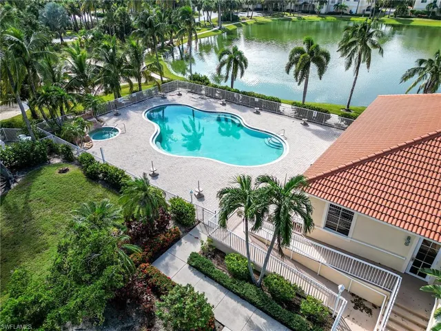 Community pool featuring a water view
