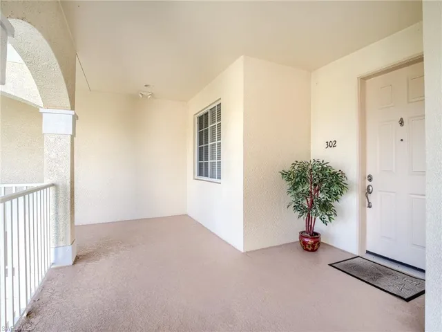 Doorway to property with stucco siding
