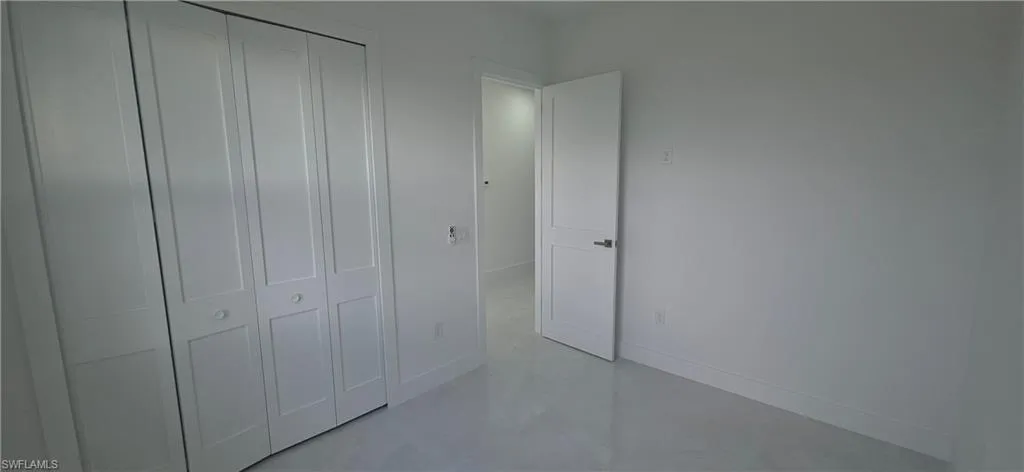 White bi-fold closet doors with panel detailing