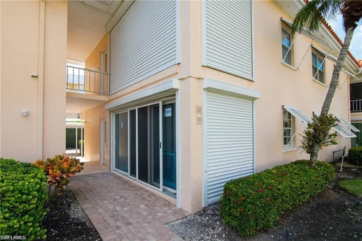 View of property exterior featuring stucco siding and a balcony
