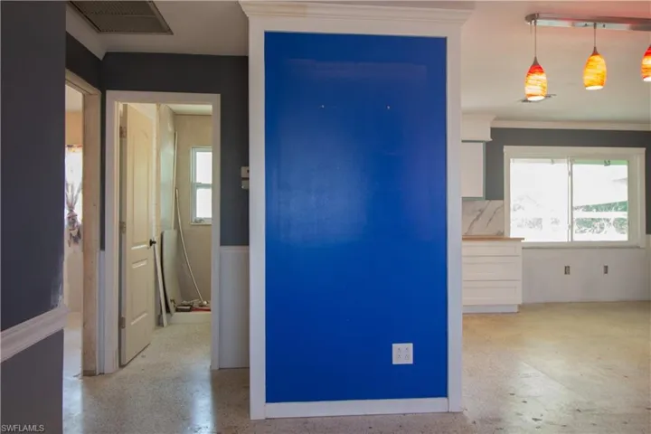 Hall featuring crown molding and visible vents