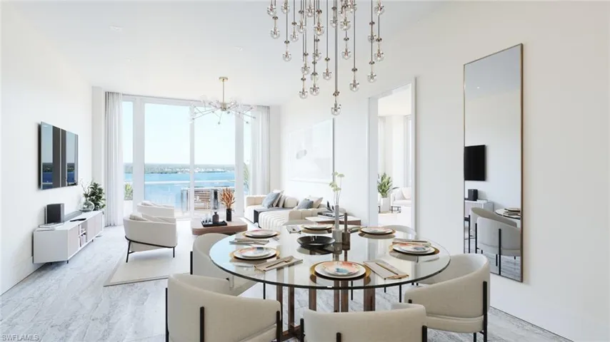 Dining area with a notable chandelier and a wall of windows