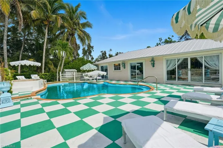 Outdoor pool featuring a gazebo and a patio area - Virtually Edited Image