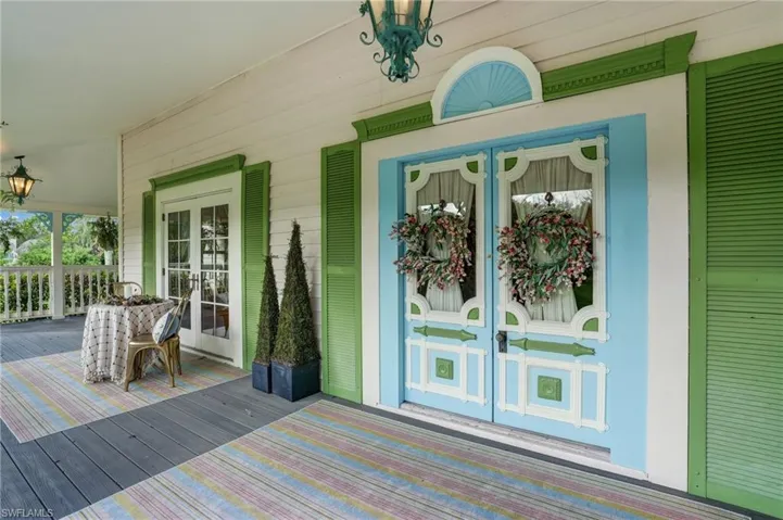 View of exterior entry featuring french doors - Virtually Edited Image