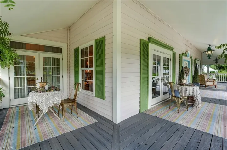 Wooden deck featuring french doors - Virtually Edited Image
