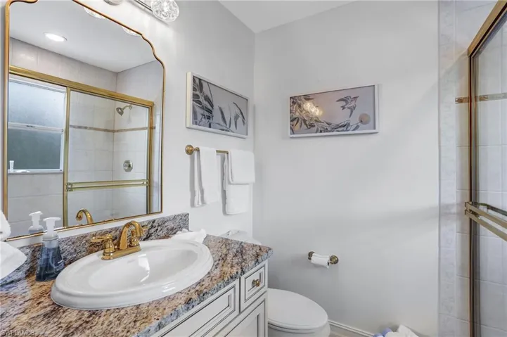 Full bathroom with vanity and a tile shower - Virtually Edited Image