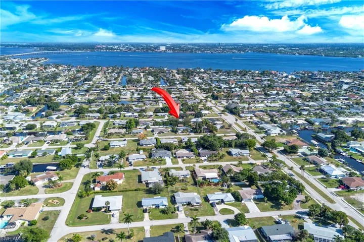 Aerial overview of property's location with nearby suburban area