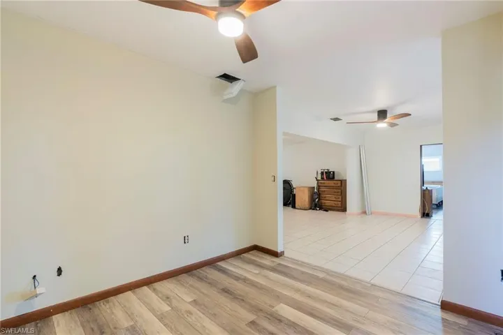Spare room with ceiling fan and light wood-style floors