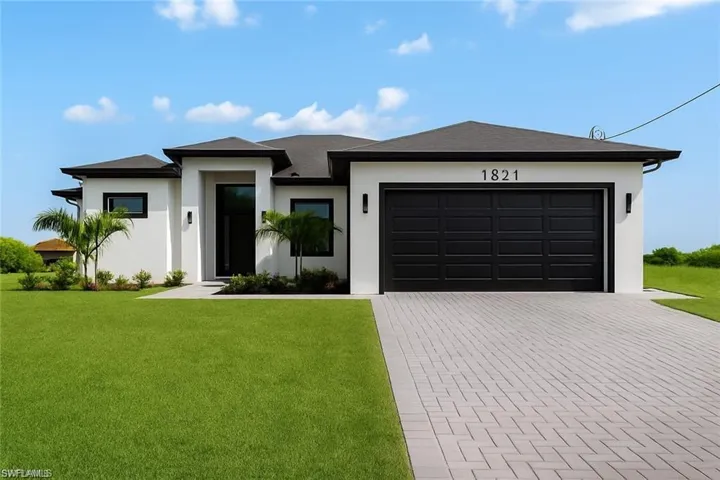 Contemporary exterior featuring a contrasting dark roof and trim against white stucco
