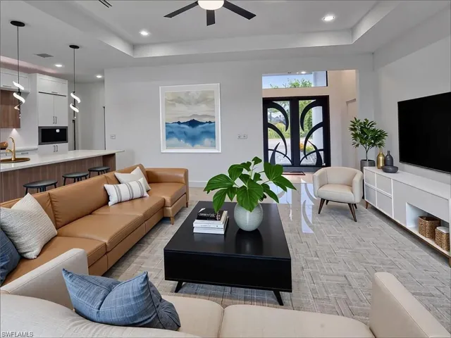 Open concept living area featuring wood-finish flooring, recessed lighting, and a modern ceiling fan