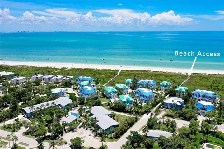 Drone / aerial view with a beach view and a water view