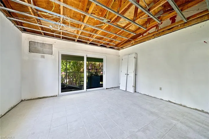 Empty room with light tile patterned floors