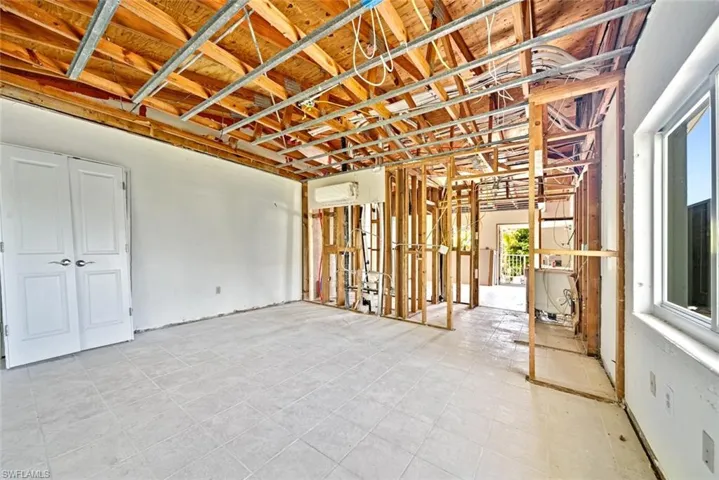 Misc room with light tile patterned floors