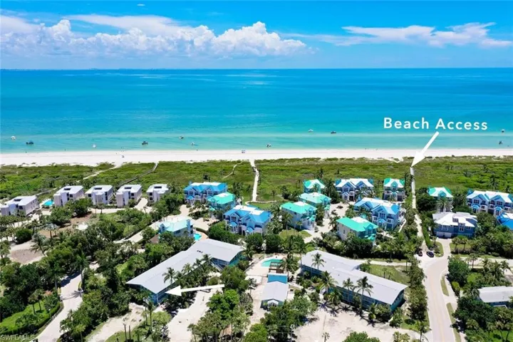 Bird's eye view with a water view and a view of the beach