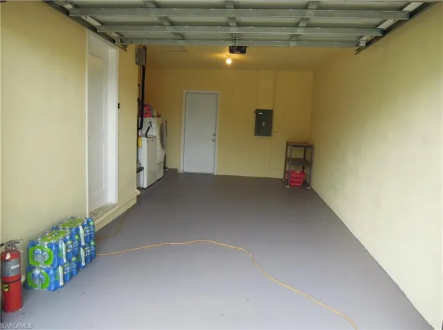 Garage with garage door opener. This is before storage of personal items