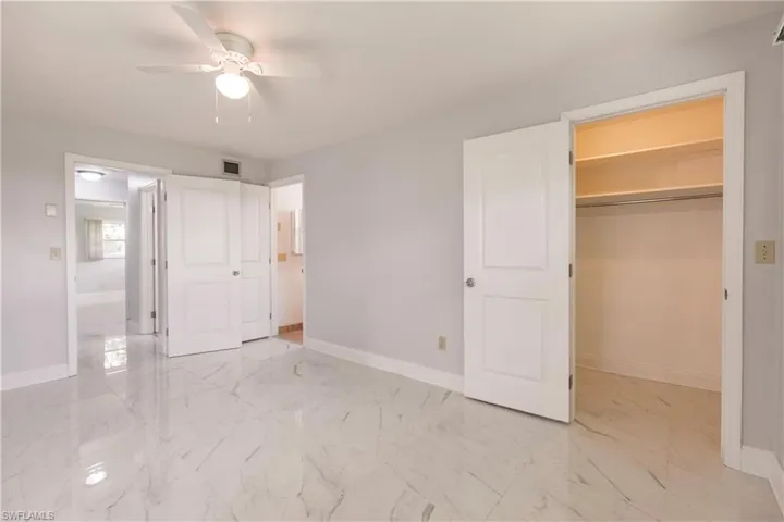 Primary bedroom with walk in closet