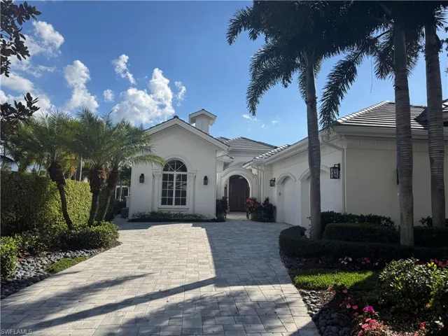 Mediterranean / spanish-style house featuring a garage