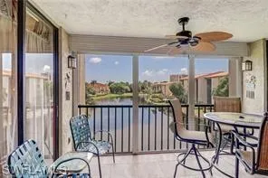 Sunroom featuring ceiling fan
