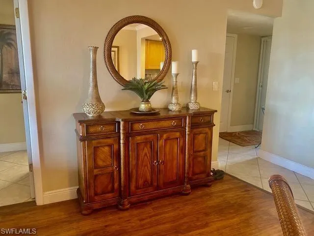 Interior details featuring baseboards and wood finished floors