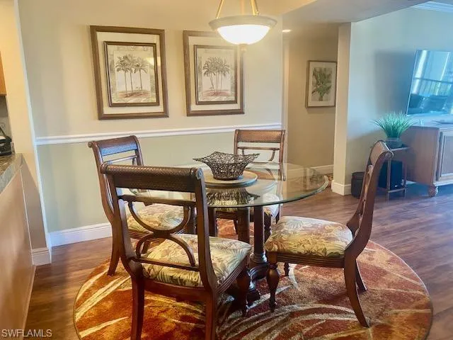 Dining area featuring baseboards and wood finished floors