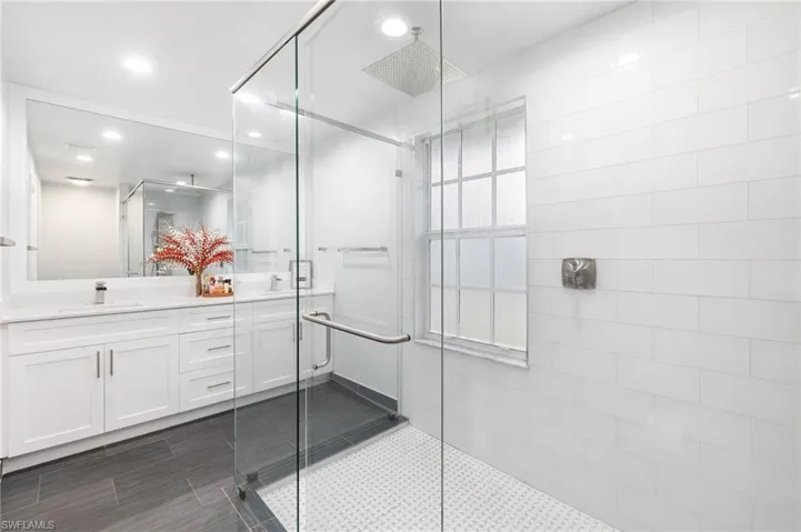 Bathroom featuring vanity and walk in shower