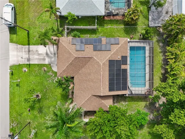 View of subject property with a pool