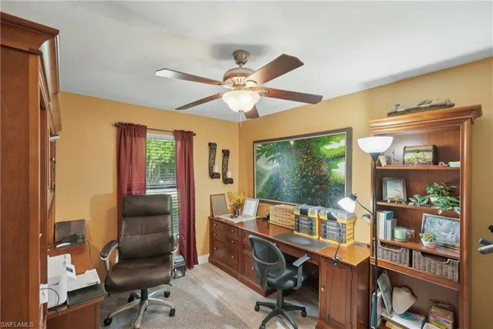 Office area with a ceiling fan
