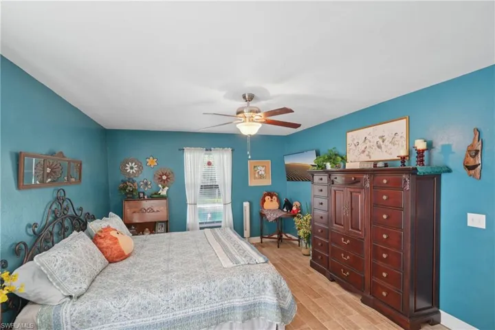 Bedroom featuring light wood-style floors and a ceiling fan