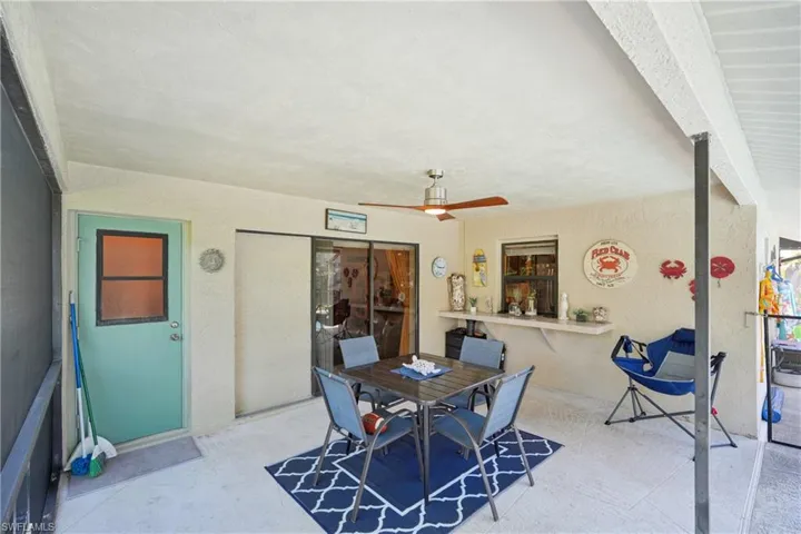 View of patio / terrace with a ceiling fan and outdoor dining area