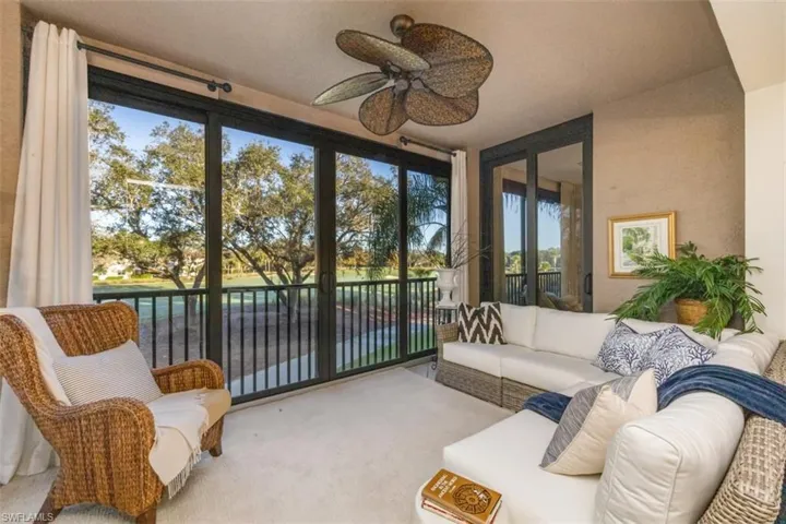 Sunroom with carpet flooring