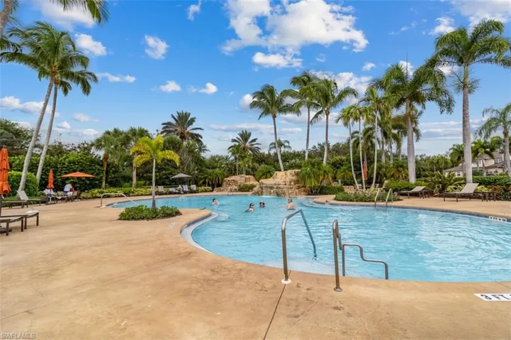 Community pool with a patio