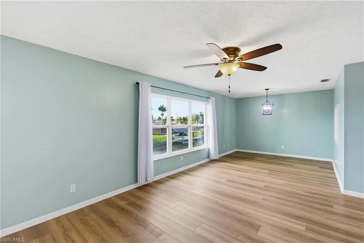 Combined living room/dining room is nice and bright from trio of new windows with southern exposure.