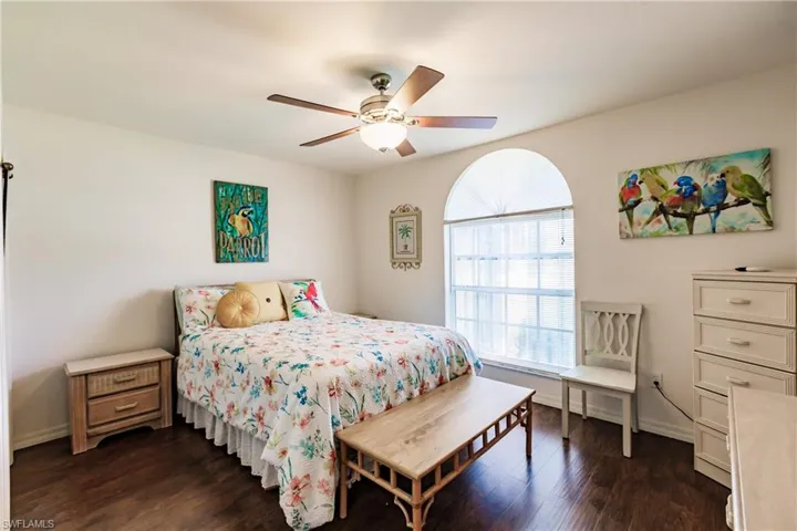 Bedroom featuring dark wood-type flooring