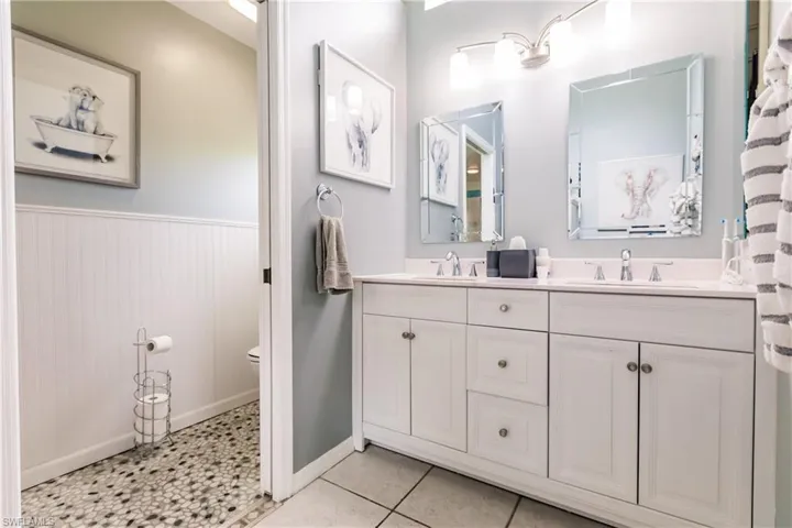 Bathroom with vanity, and tile floors