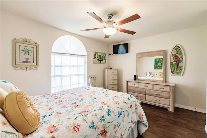 Bedroom featuring and dark hardwood / wood-style flooring