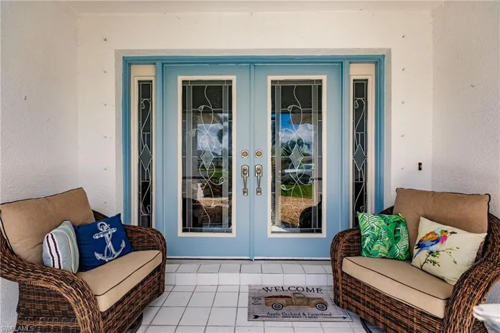 Property entrance featuring french doors