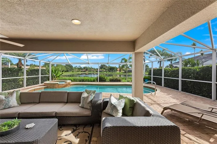 Covered area looking directly out to pool, lake beyond
