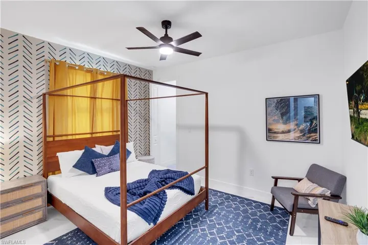 Bedroom with baseboards and a ceiling fan