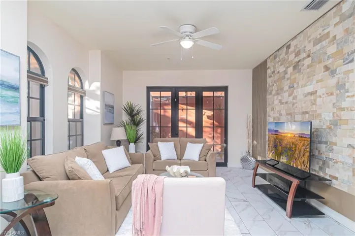Living room with french doors and ceiling fan