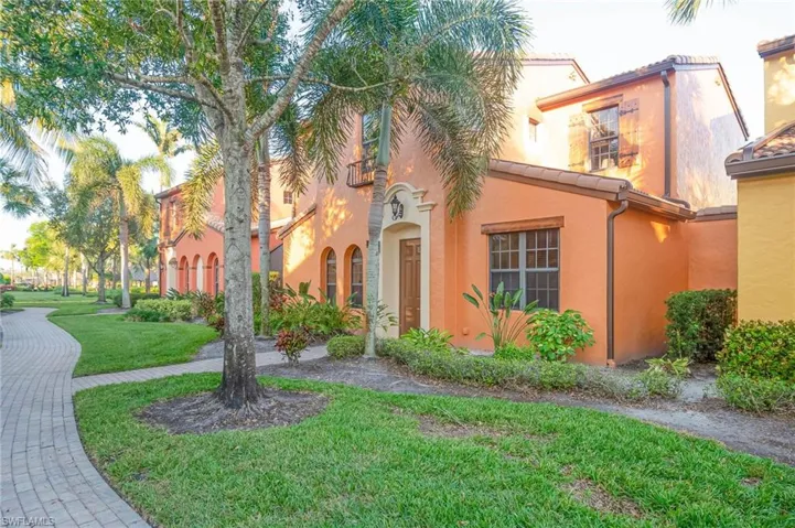 Mediterranean / spanish-style house with a front yard