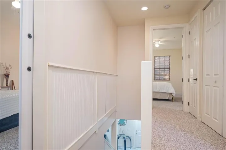 Hallway with light carpet