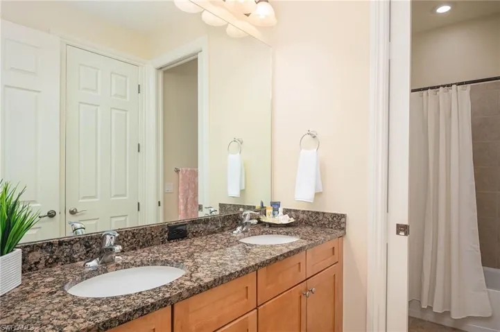 Bathroom featuring vanity and shower / tub combo