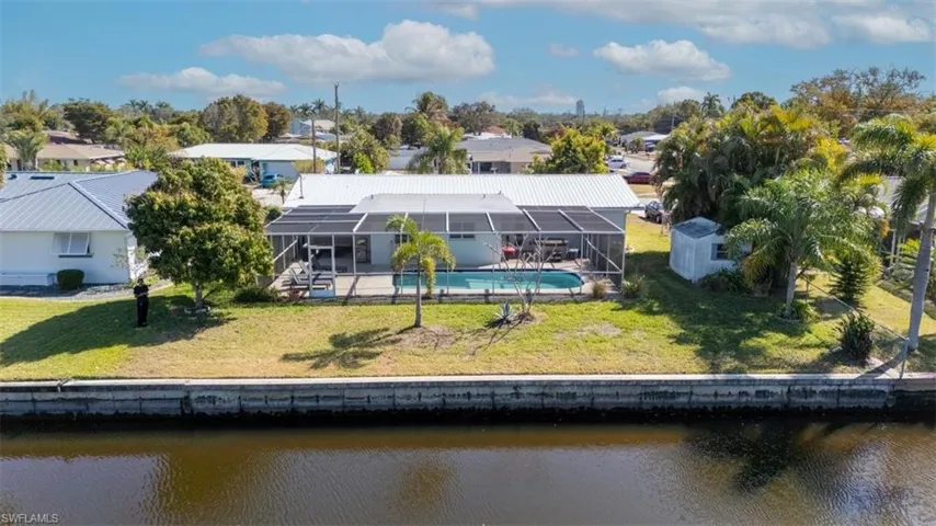 Aerial view of residential area with a large body of water