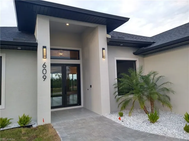 View of exterior entry featuring french doors
